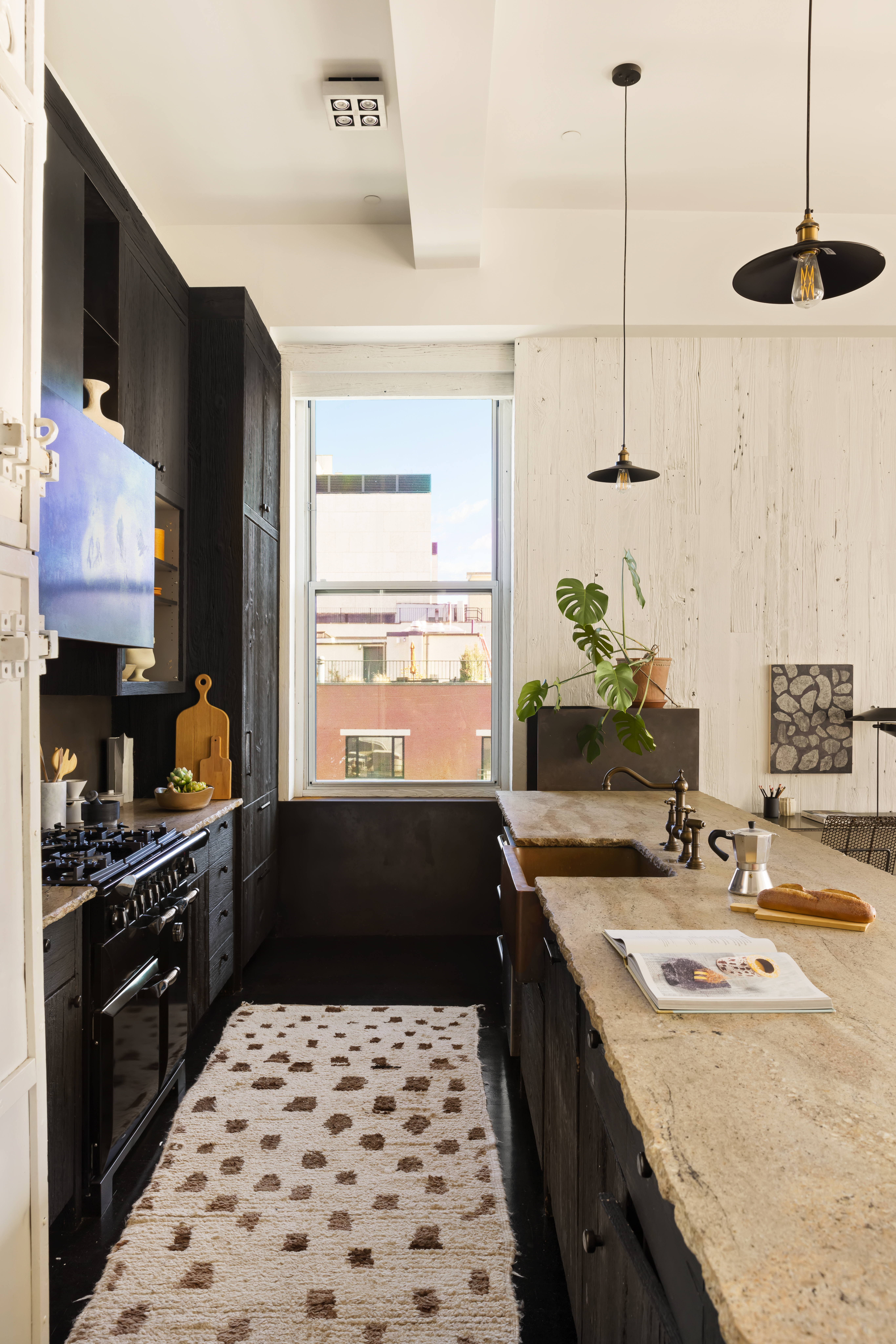 7 Bond Street, Unit PHAB Manhattan, NY 10012 - Photo 6 of 20 a kitchen with a sink stove and refrigerator