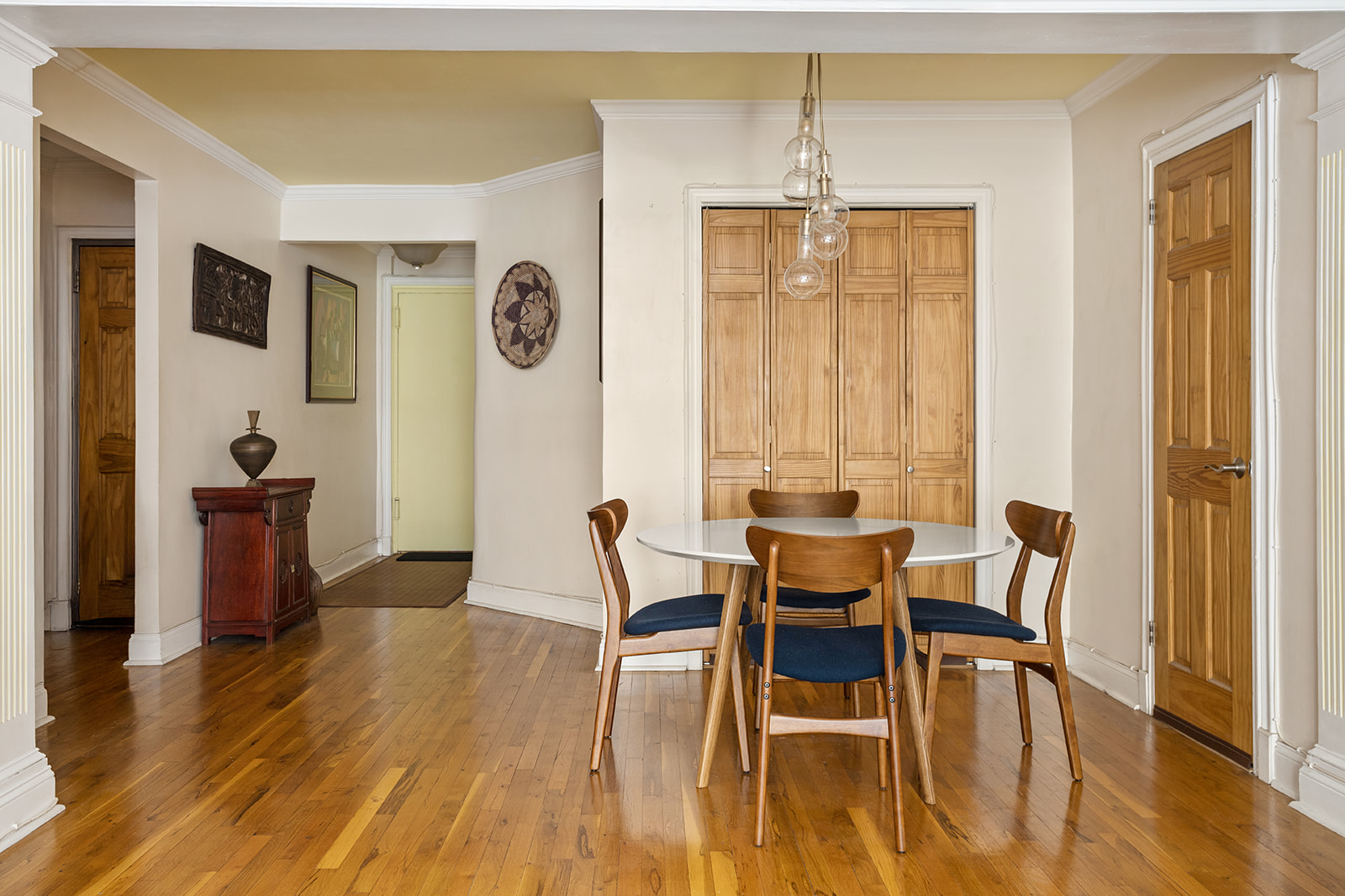 79-10 34th Avenue, Unit 2G Queens, NY 11372 - Photo 3 of 11 a dining room with furniture and wooden floor
