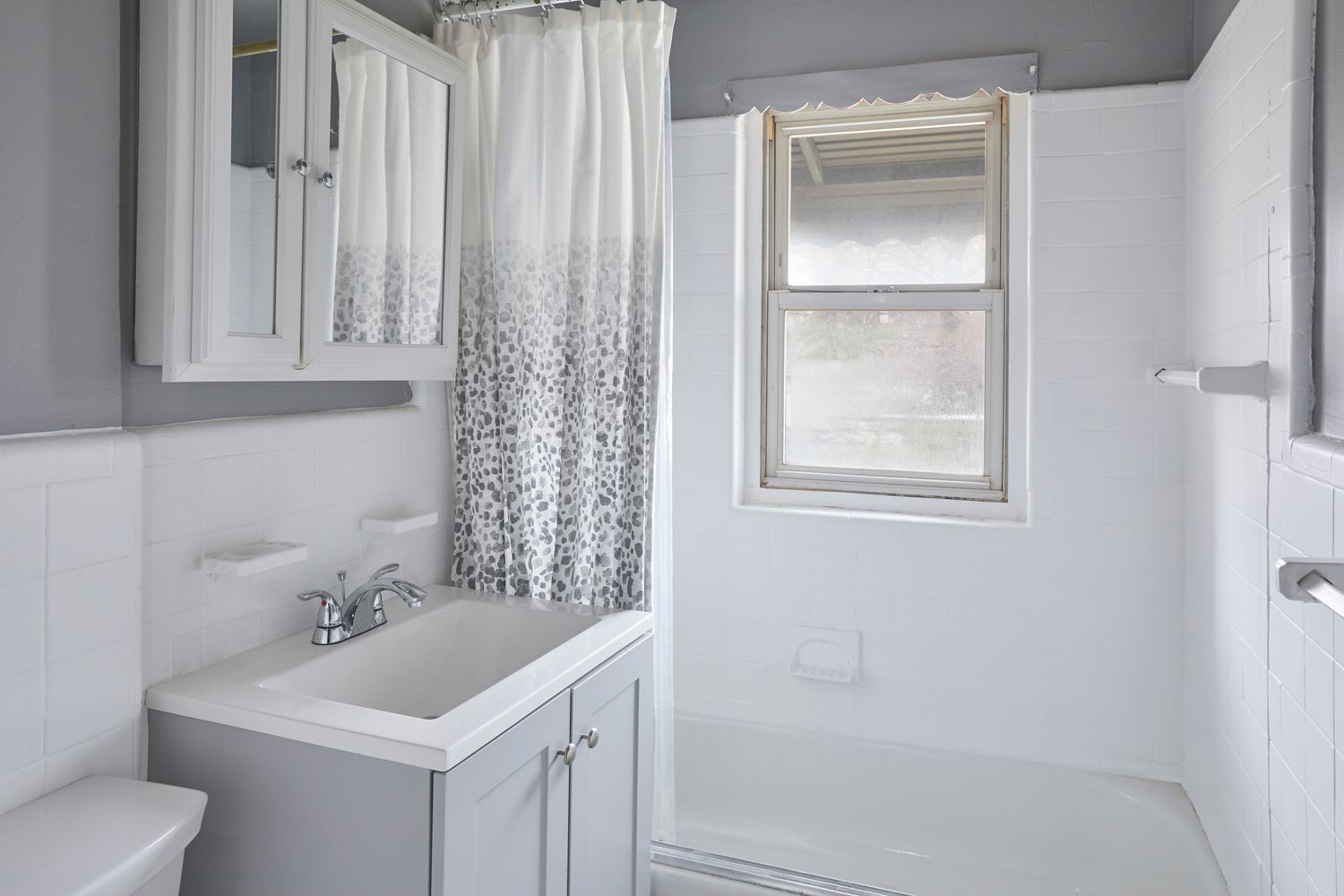a bathroom with a sink toilet and vanity
