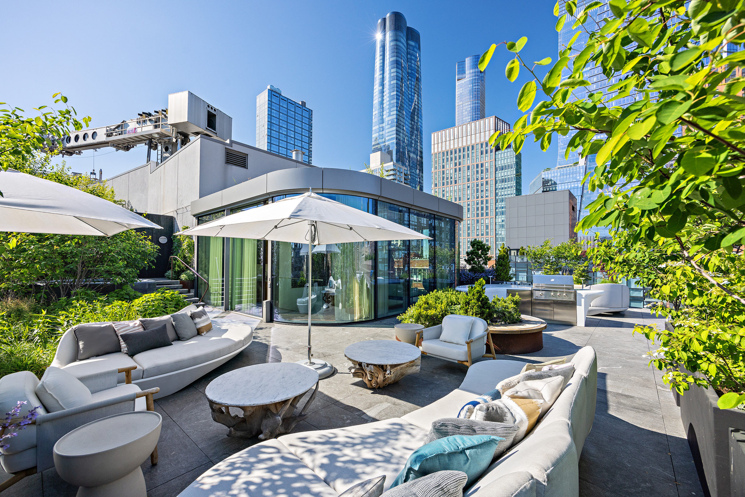 520 West 28th Street, Unit PH37 Manhattan, NY 10001 - Photo 3 of 45 a view of a patio with couches under an umbrella
