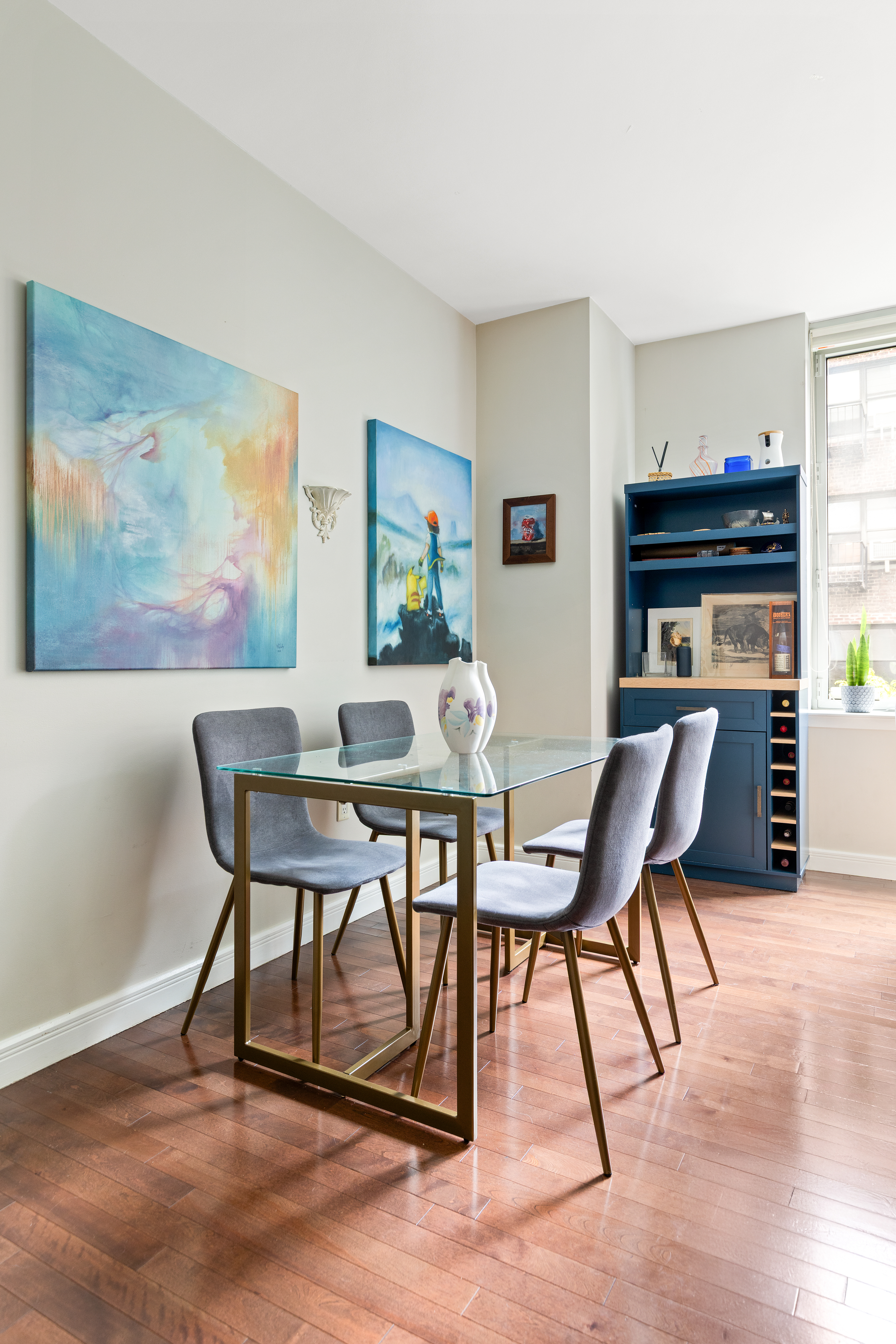225 East 34th Street, Unit 3K Manhattan, NY 10016 - Photo 5 of 19 a view of a dining room with furniture and wooden floor