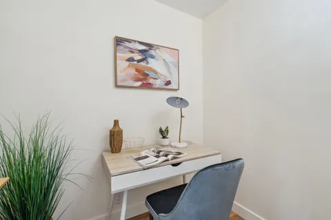 a view of a workspace with furniture