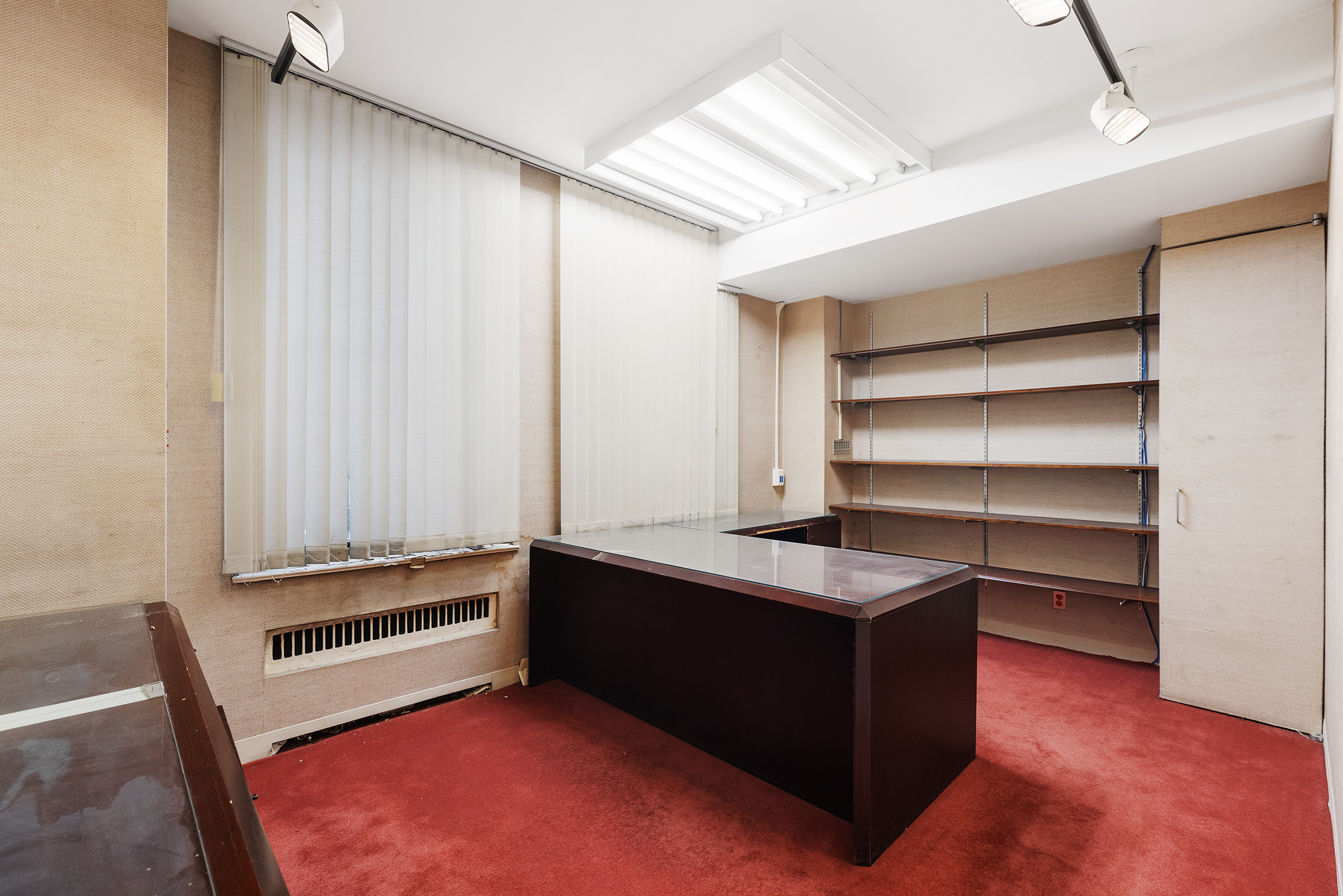47 East 88th Street Manhattan, NY 10128 - Photo 5 of 11 a room with cabinets and window
