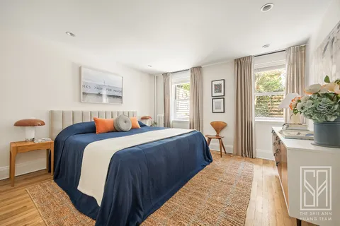 a bed room with a bed and a couch