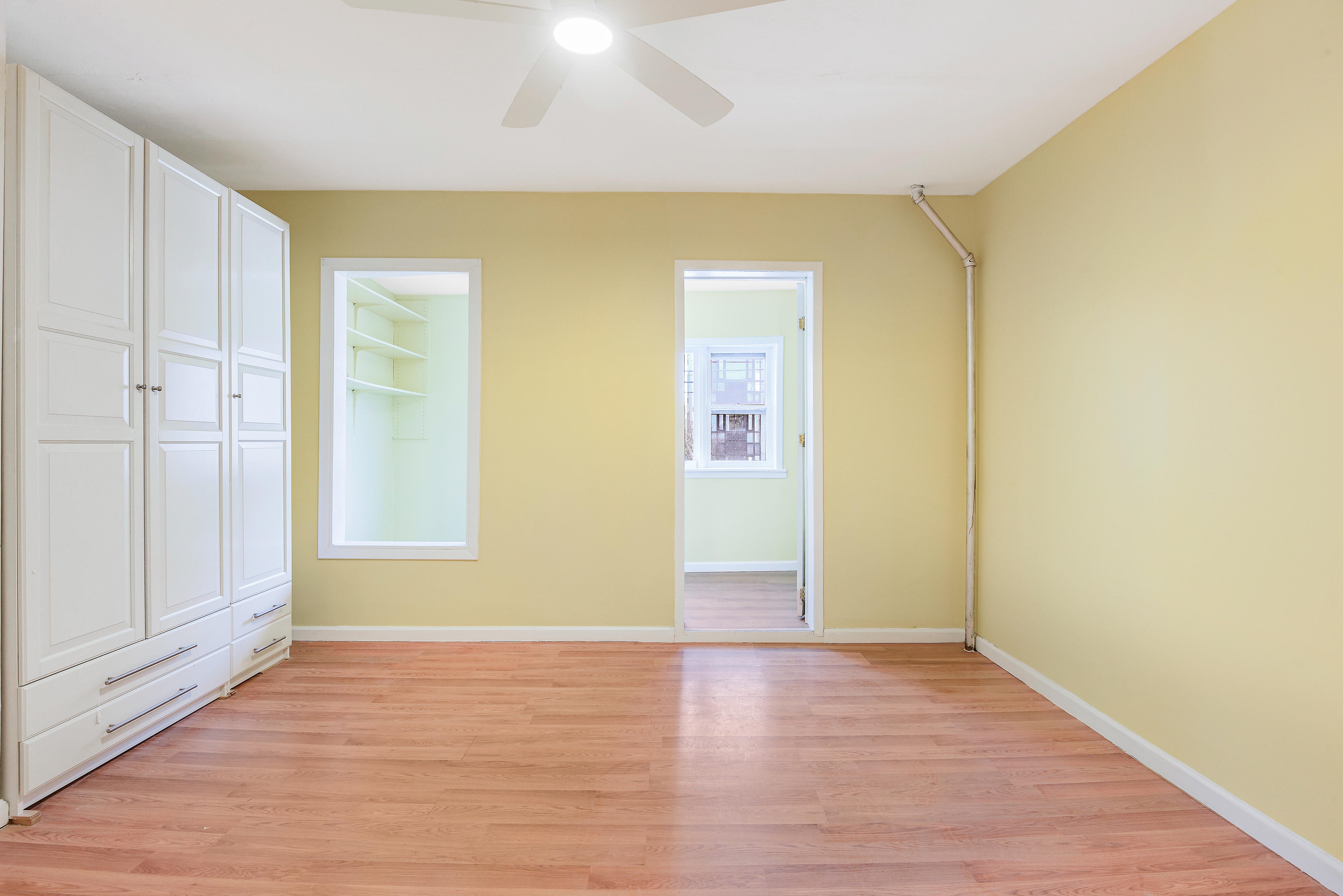 35-47 30th Street, Unit 1 Queens, NY 11106 - Photo 5 of 15 a view of empty room with wooden floor