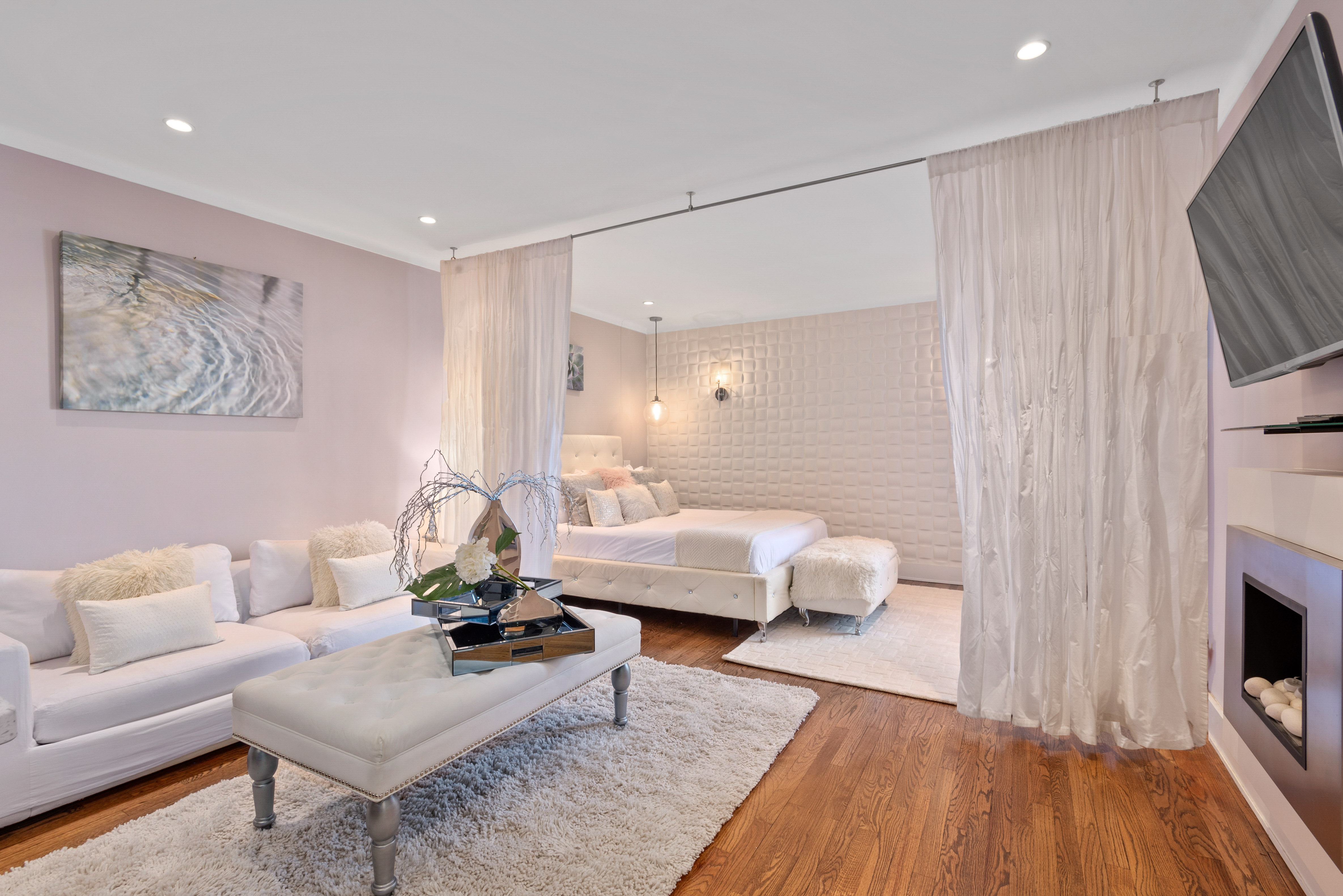 a living room with furniture and a fireplace