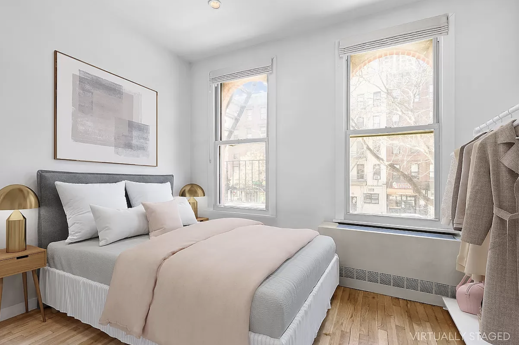 1582 York Avenue, Unit 5A Manhattan, NY 10028 - Photo 2 of 9 a bedroom with a bed and a window