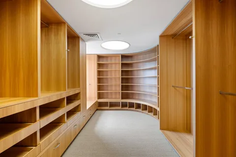 a living room with furniture and large windows