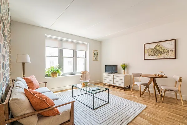 310 Clarkson Avenue, Unit 511 Brooklyn, NY 11226 - Photo 2 of 12 a living room with furniture and a wooden floor