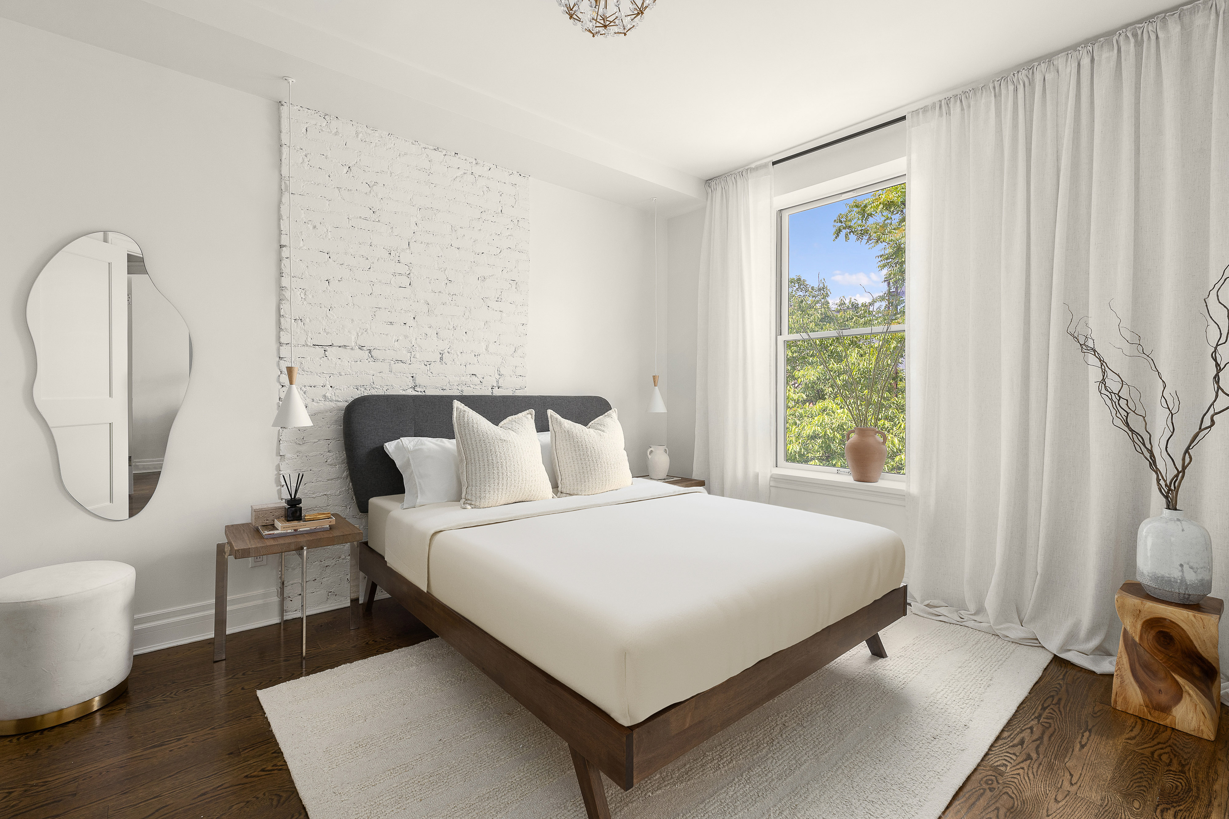 695 Degraw Street, Unit 2 Brooklyn, NY 11217 - Photo 6 of 11 a bedroom with a bed a mirror and a window