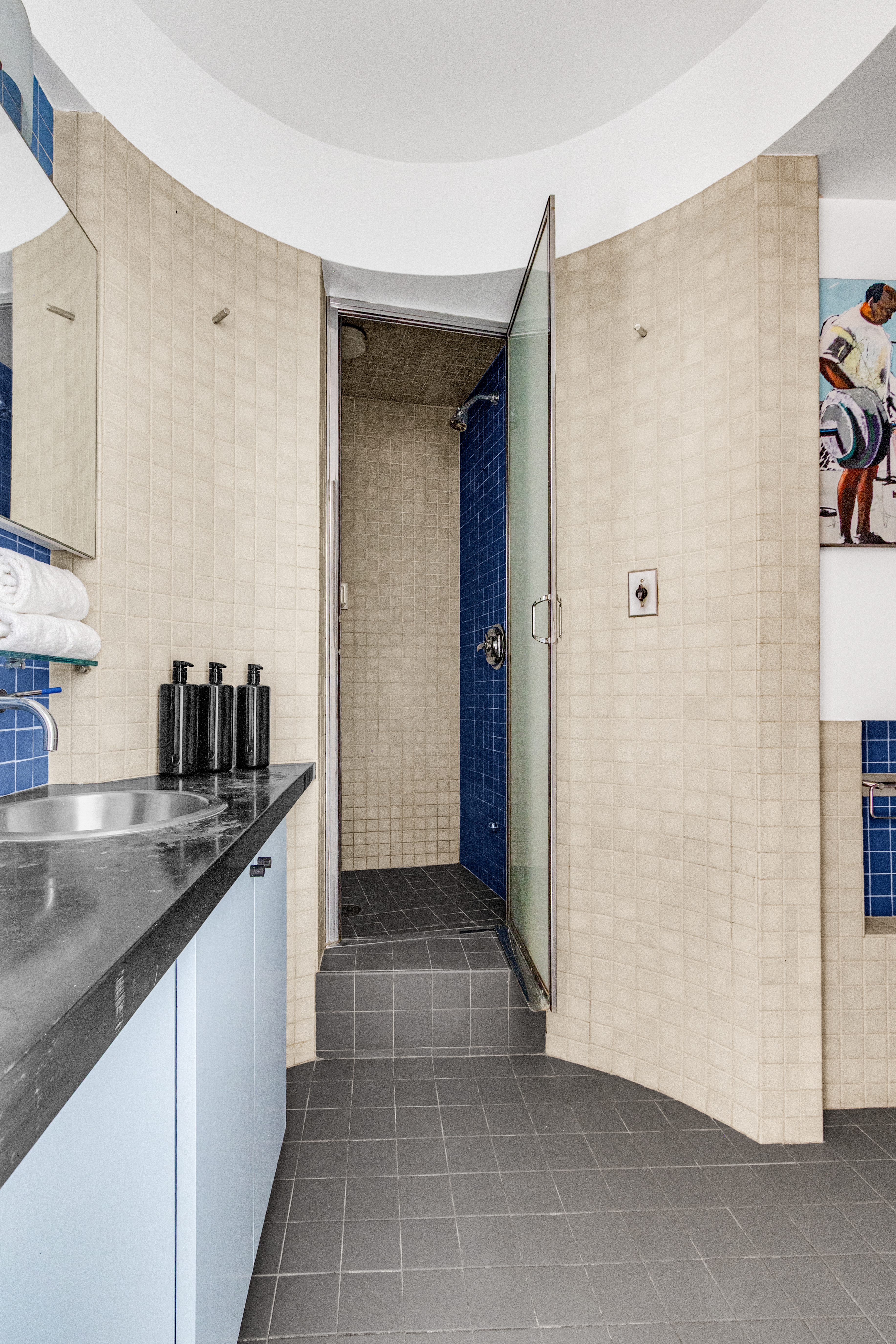 345 East 52nd Street, Unit 10CD Manhattan, NY 10022 - Photo 8 of 14 a kitchen with stainless steel appliances granite countertop a refrigerator and a sink