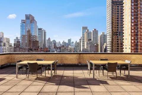 a view of chairs and table in the terrace