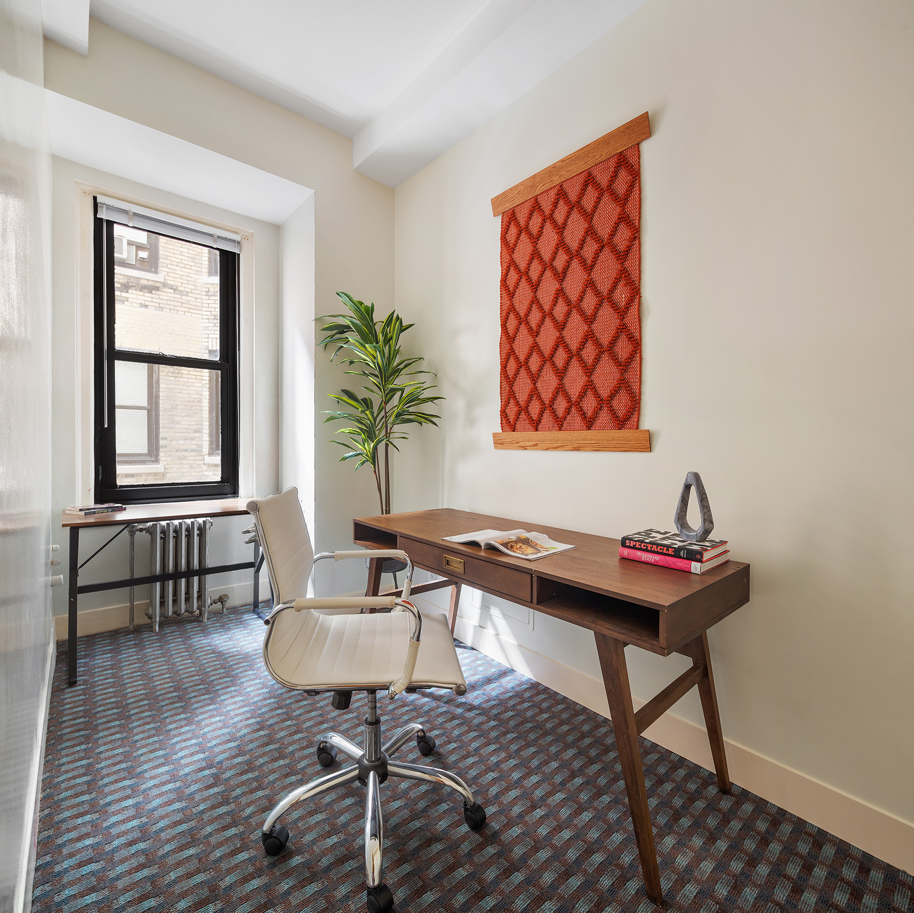 1115 5th Avenue, Unit 5B Manhattan, NY 10128 - Photo 10 of 19 a view of a workspace room with furniture and wooden floor