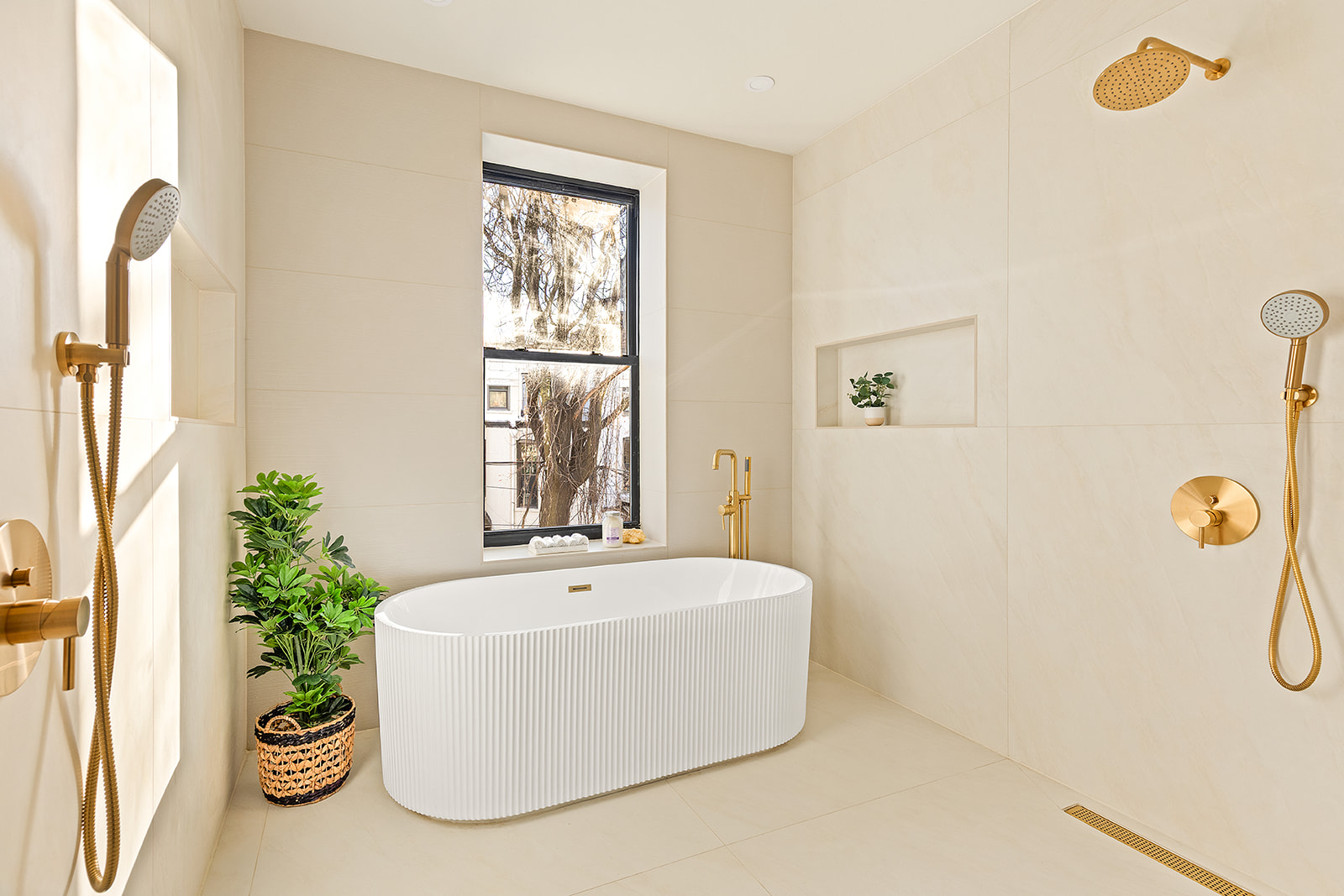 966 St Johns Place Brooklyn, NY 11213 - Photo 12 of 20 a white bath tub sitting in a bathroom next to a window