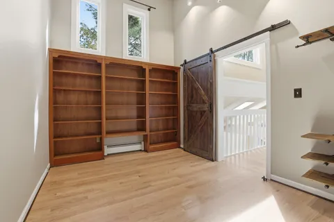 a kitchen with granite countertop a sink and cabinets