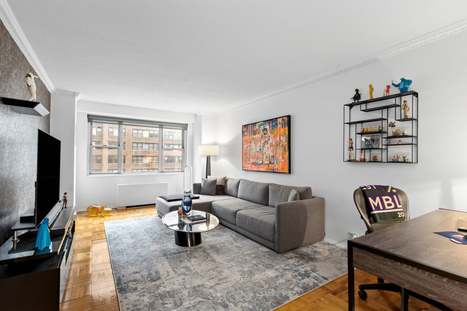 a living room with furniture and a flat screen tv