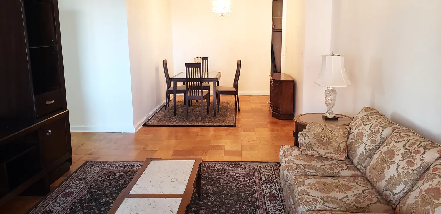 a kitchen with a refrigerator and a stove top oven