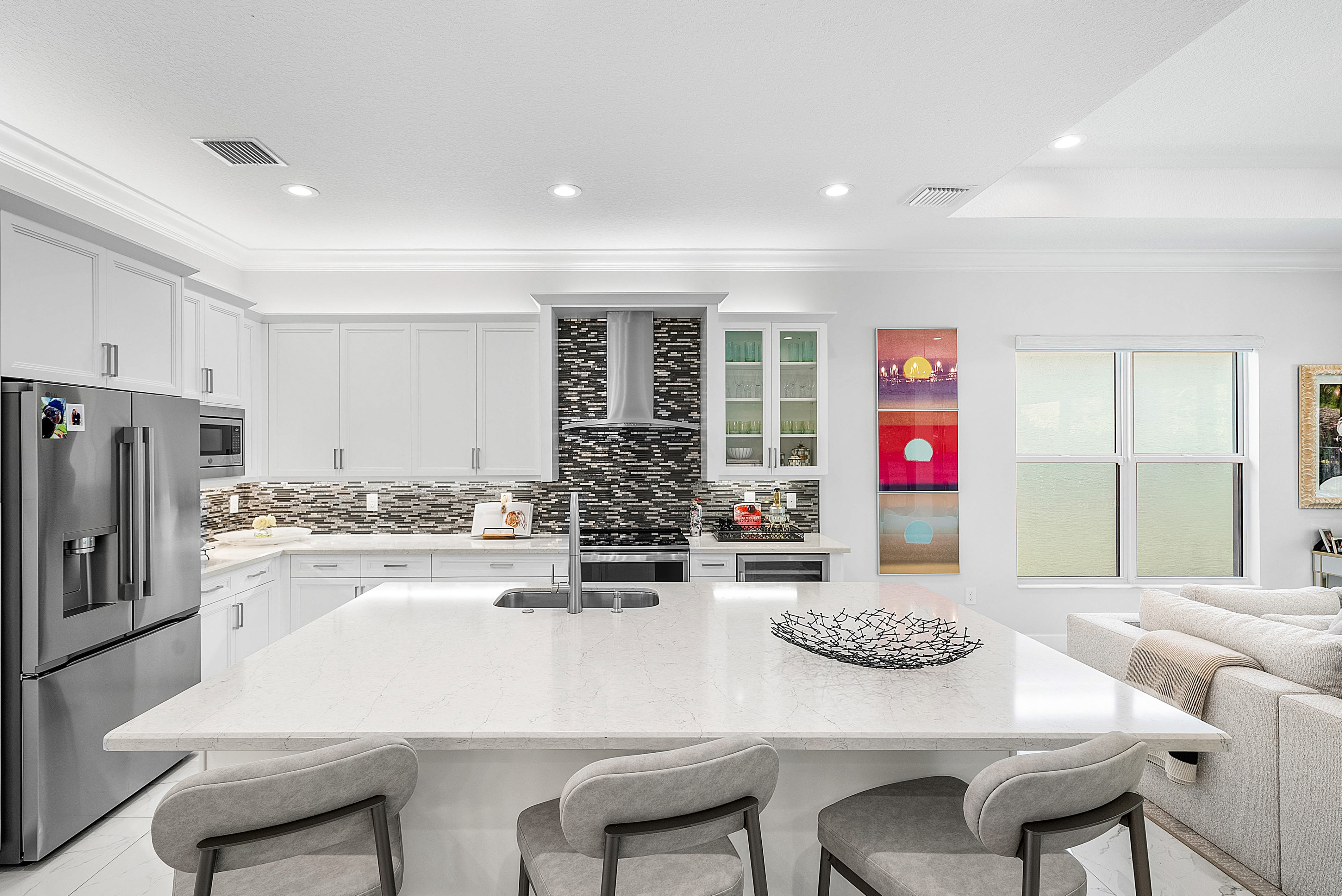 13172 Whistler Mountain Road Delray Beach, FL 33446 - Photo 15 of 38 a kitchen with a table and chairs