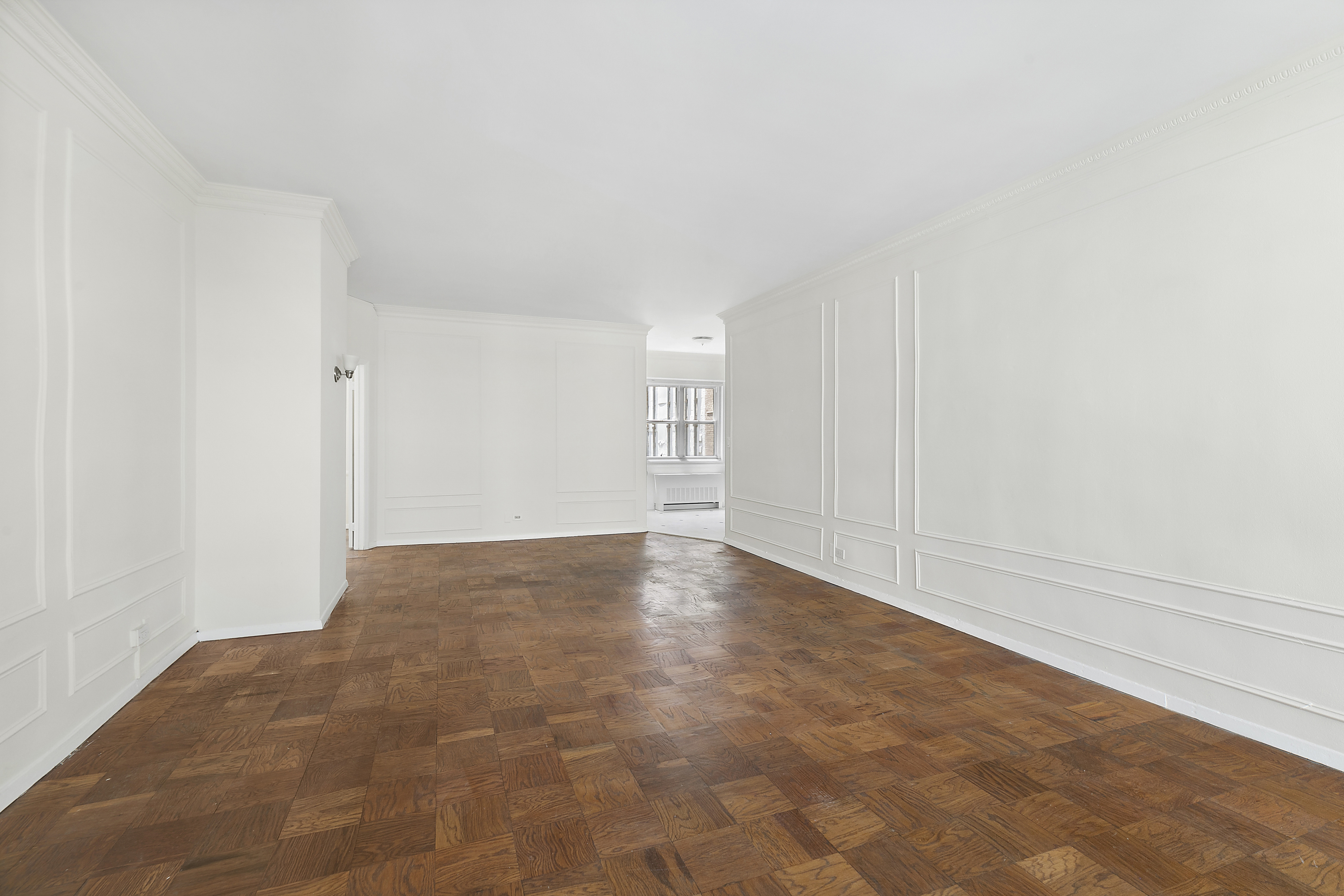 58 West 58th Street, Unit 4C Manhattan, NY 10019 - Photo 9 of 14 a view of an empty room and window