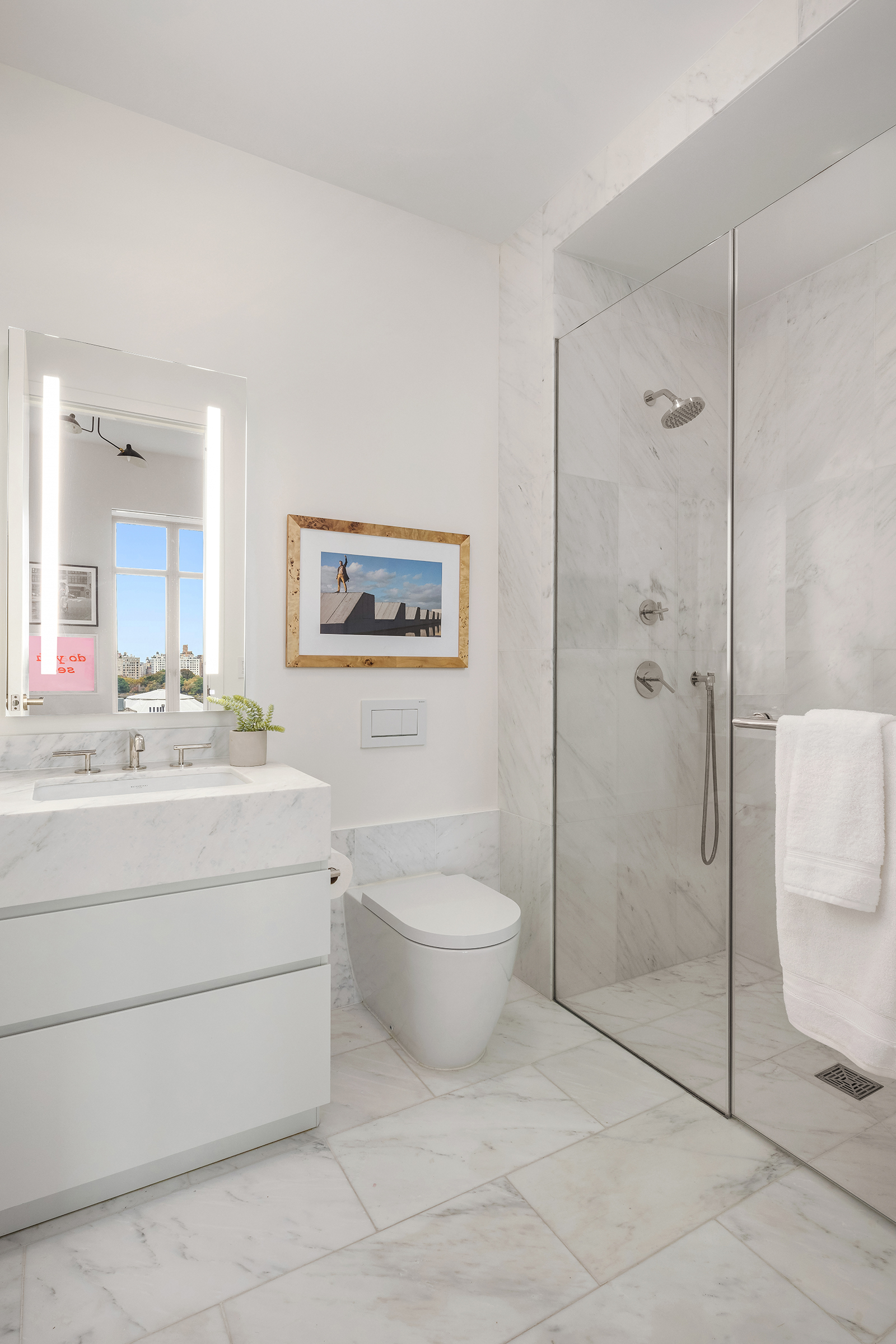 1228 Madison Avenue, Unit 10 Manhattan, NY 10128 - Photo 16 of 21 a bathroom with a toilet sink and shower