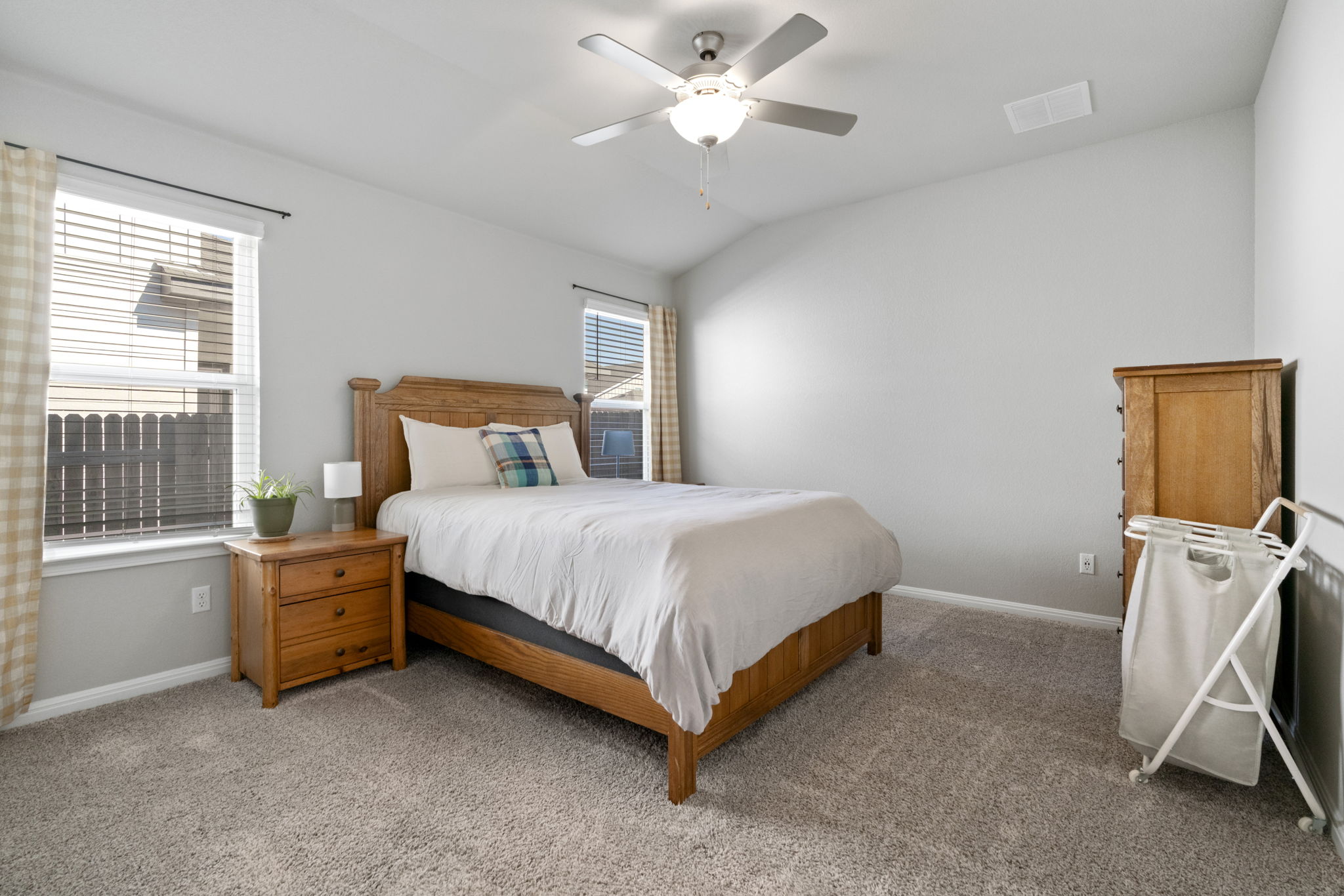 107 Magnolia Ranch Lane Hutto, TX 78634 - Photo 14 of 28 Carpeted bedroom featuring lofted ceiling and a ceiling fan