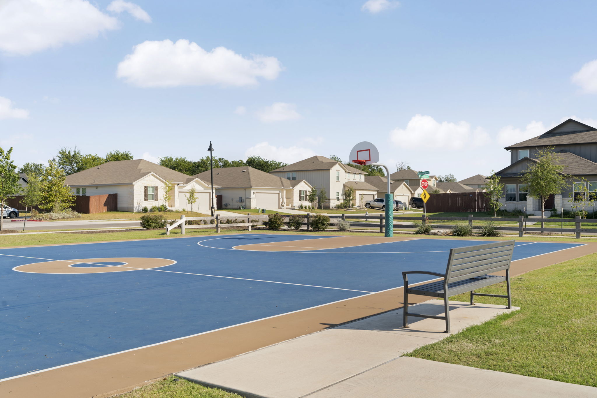 107 Magnolia Ranch Lane Hutto, TX 78634 - Photo 28 of 28 View of sport court featuring community basketball court and a residential view