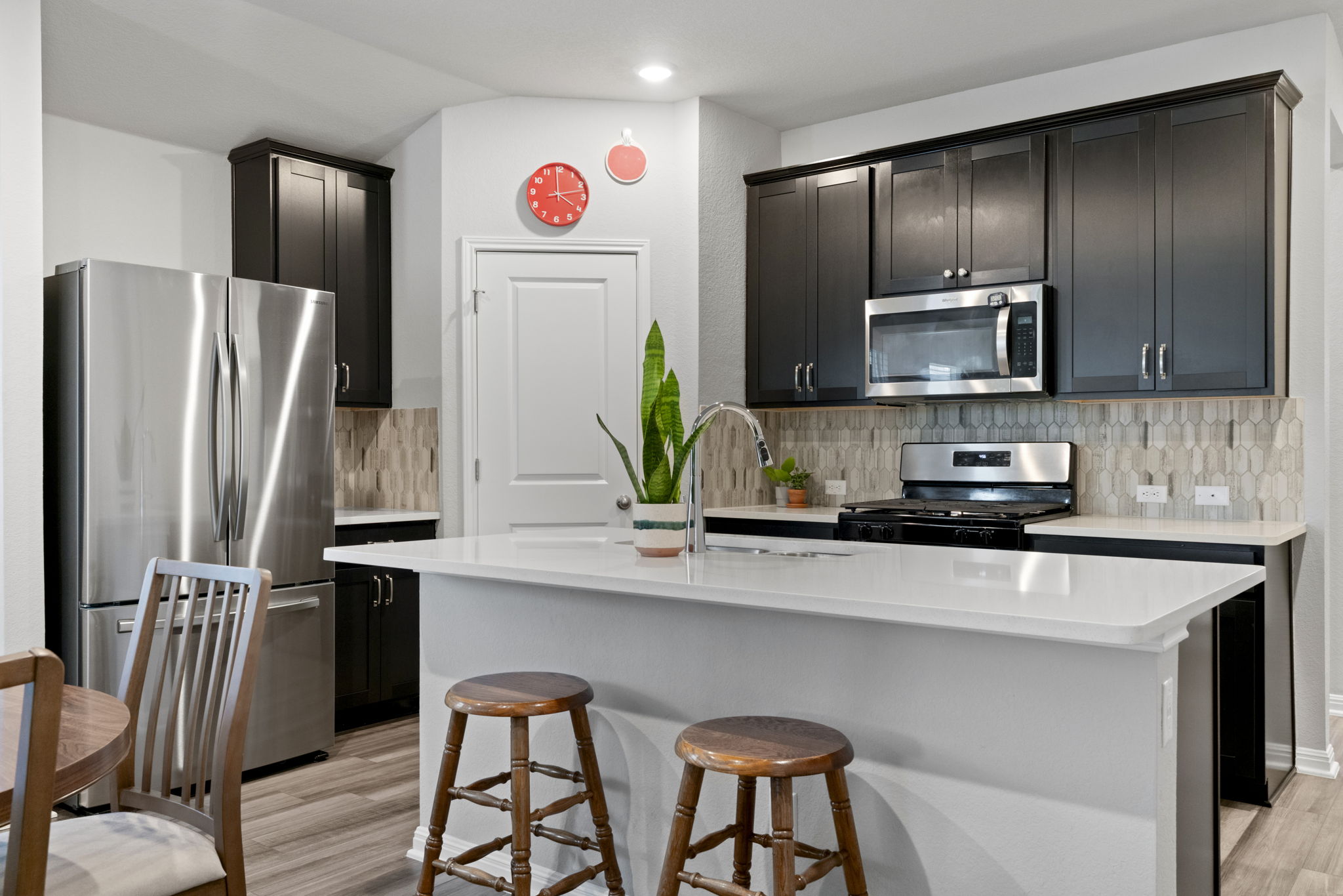 107 Magnolia Ranch Lane Hutto, TX 78634 - Photo 3 of 28 Kitchen with stainless steel appliances, a center island with sink