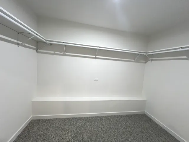 a view of an empty walk in closet