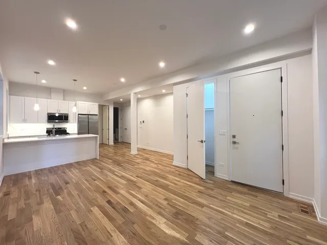 a view of kitchen with wooden floor