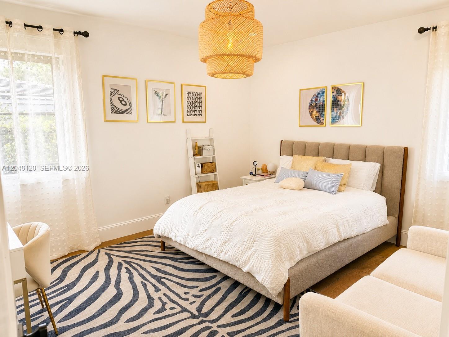 4455 North Bay Road Miami Beach, FL 33140 - Photo 9 of 14 a bedroom with a bed and cupboard