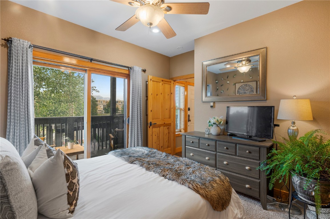 164 Buck Ridge Road, Unit 168 Dillon, CO 80435 - Photo 8 of 31 Guest bedroom with outdoor living access