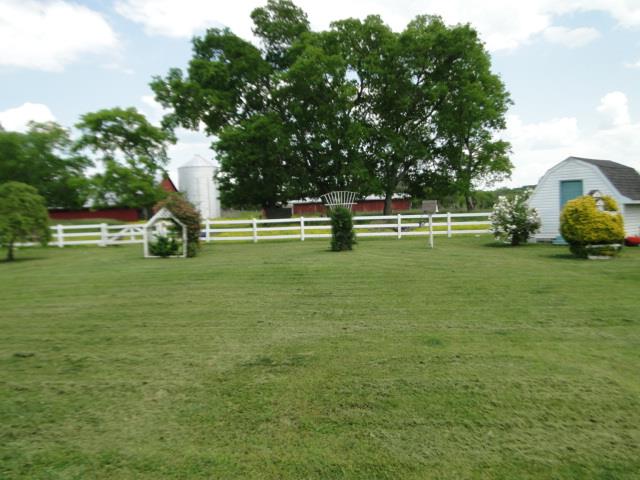 256 Edd Joyce Road Bell Buckle, TN 37020 - Photo 18 of 20 Side yard with barns in the distance.