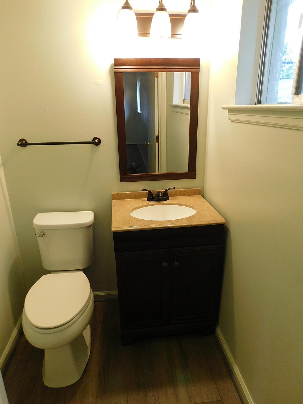 706 Ramada Road Vinton, VA 24179 - Photo 14 of 17 a bathroom with a toilet sink vanity and mirror