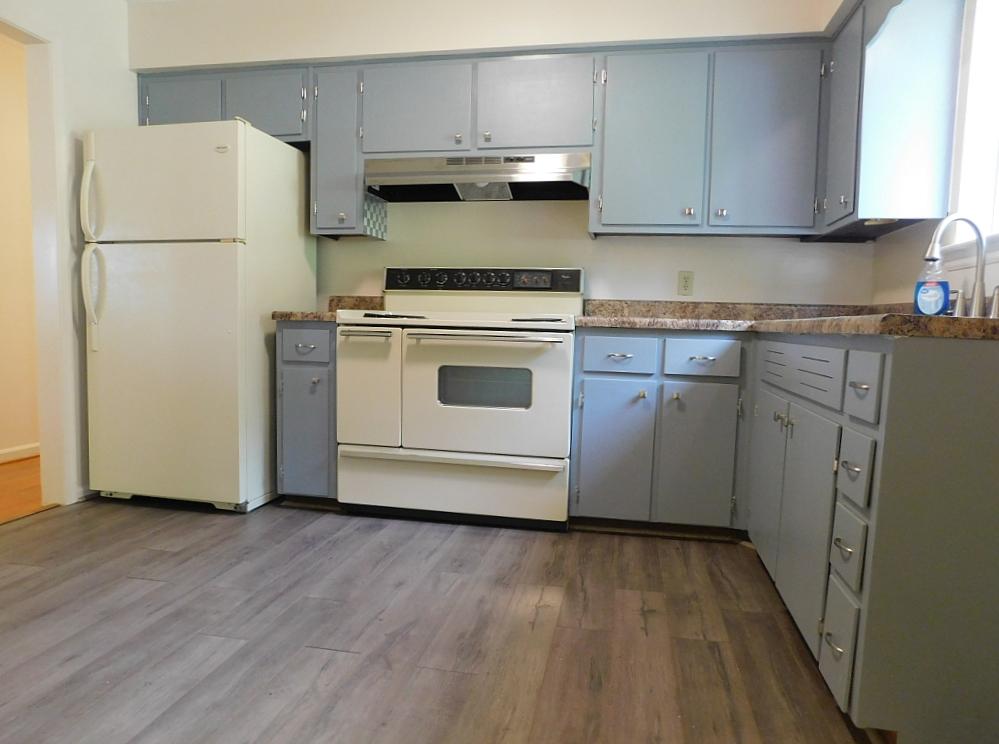 706 Ramada Road Vinton, VA 24179 - Photo 5 of 17 a kitchen with a white cabinets and white appliances
