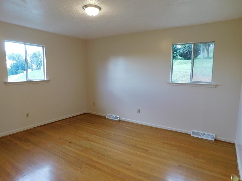 706 Ramada Road Vinton, VA 24179 - Photo 8 of 17 an empty room with a window