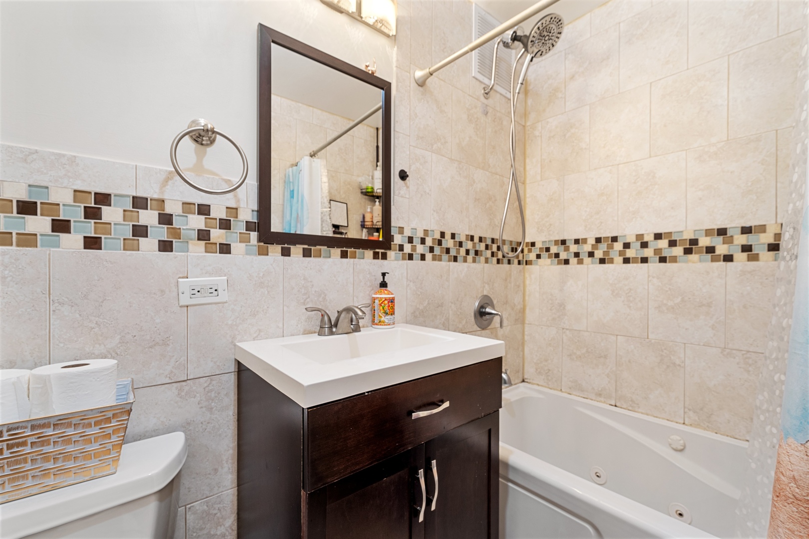 655 West Irving Park Road, Unit 1101 Chicago, IL 60613 - Photo 13 of 24 a bathroom with a sink a toilet and shower