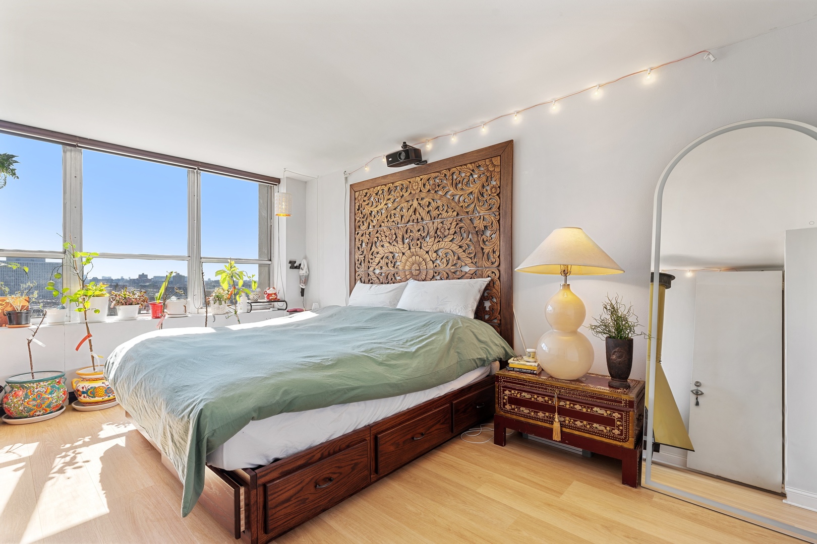 655 West Irving Park Road, Unit 1101 Chicago, IL 60613 - Photo 14 of 24 a bed sitting in a bedroom next to a window