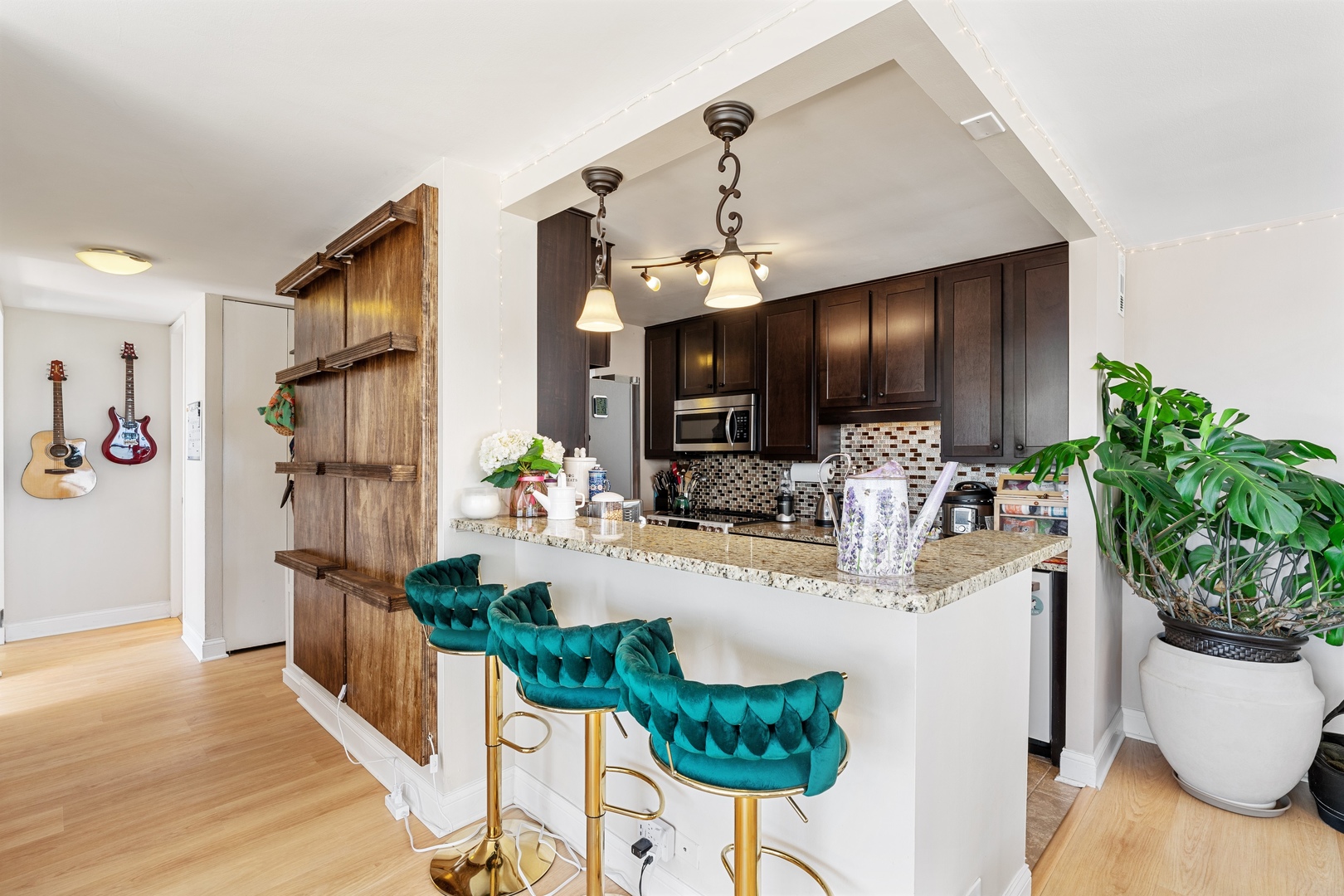 655 West Irving Park Road, Unit 1101 Chicago, IL 60613 - Photo 6 of 24 a view of kitchen with cabinets and wooden floor