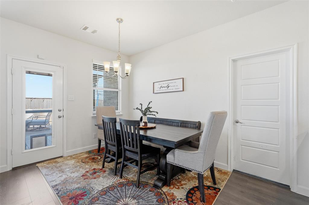 949 Philadelphia Street Fate, TX 75189 - Photo 15 of 36 a view of a dining room with furniture window and wooden floor