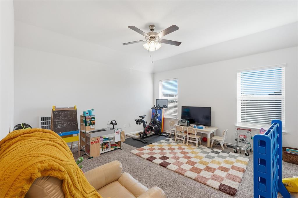 949 Philadelphia Street Fate, TX 75189 - Photo 21 of 36 a view of a livingroom with workspace and a window