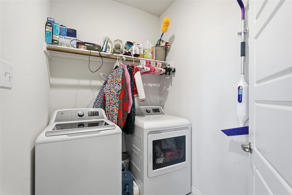 949 Philadelphia Street Fate, TX 75189 - Photo 26 of 36 a utility room with dryer and washer