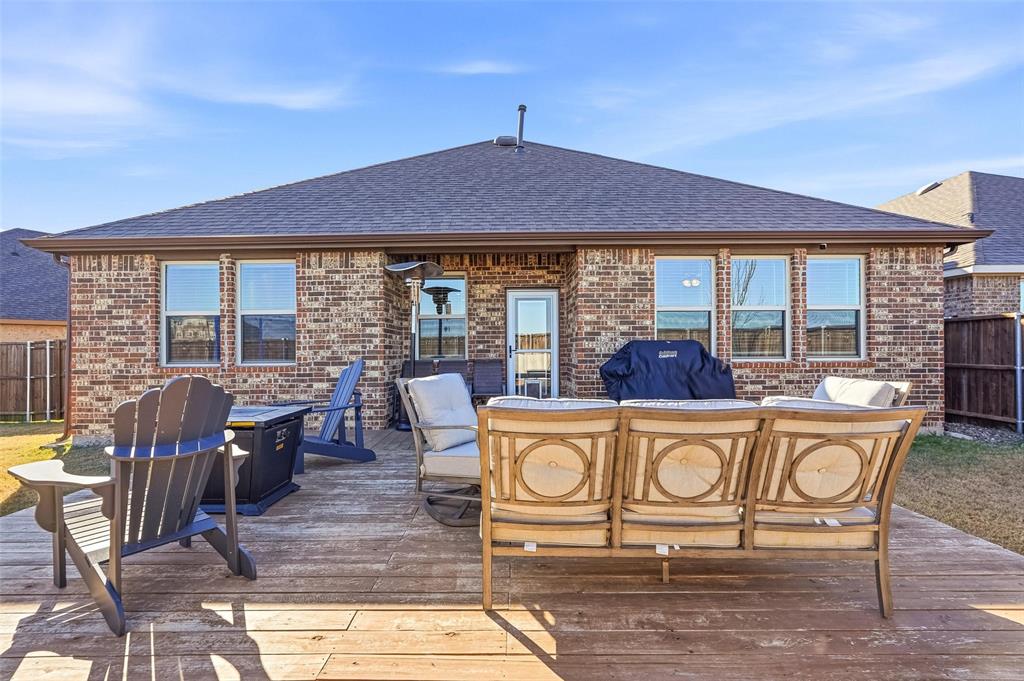 949 Philadelphia Street Fate, TX 75189 - Photo 29 of 36 a view of a table and chairs in patio