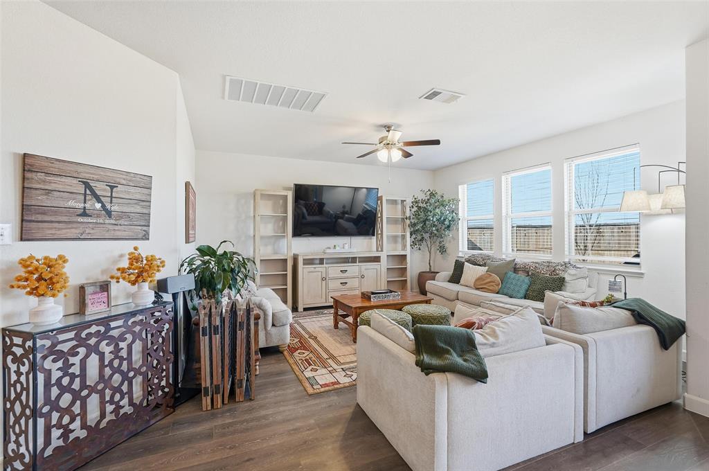 949 Philadelphia Street Fate, TX 75189 - Photo 5 of 36 a living room with furniture and a flat screen tv