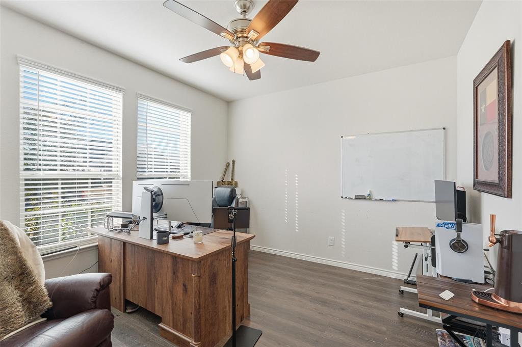 949 Philadelphia Street Fate, TX 75189 - Photo 8 of 36 a view of workspace with wooden floor windows