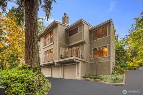 a front view of a residential apartment building with a yard