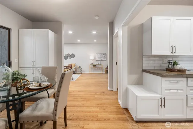 a very nice looking open dining room with kitchen island