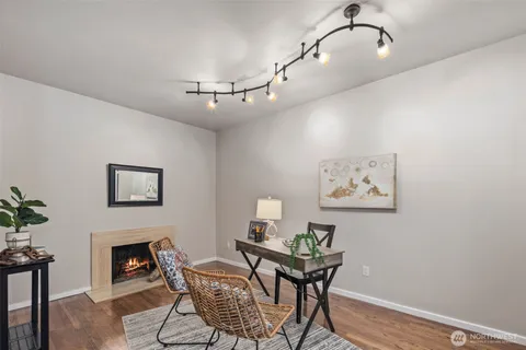 a view of a livingroom with furniture and a fireplace