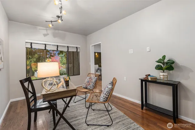 a view of a dining room with furniture window and wooden floor