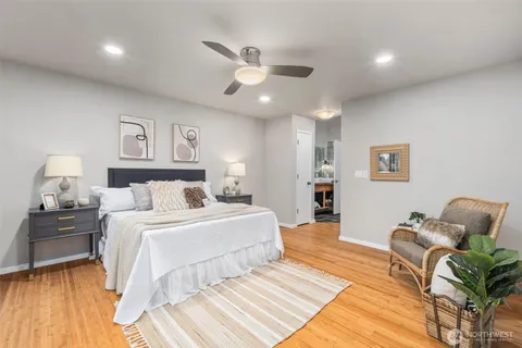 a spacious bedroom with a bed and furniture