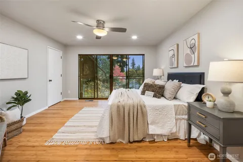 a bedroom with a large bed and a window